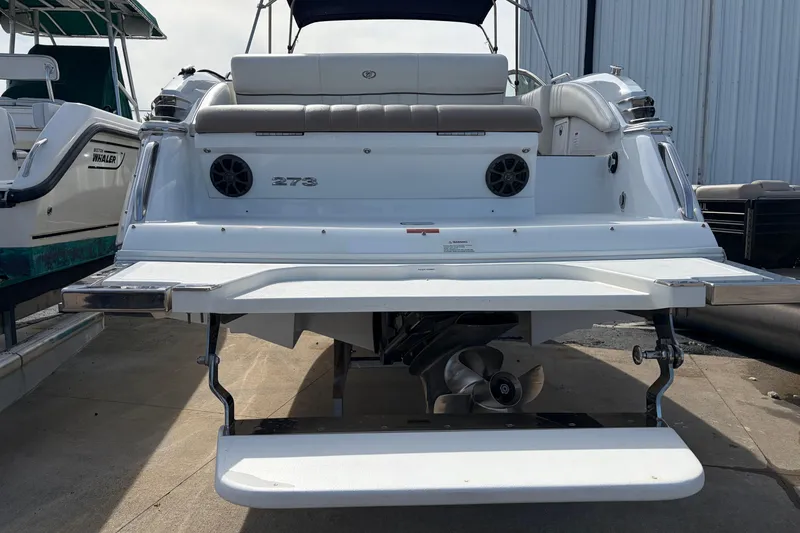 Slide: The Image of 2013 Cobalt 273 boat rear view with swim platform and propeller. - 3