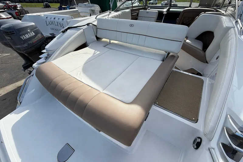 Slide: The Image of 2013 Cobalt 273 boat with Yamaha outboard motor, featuring spacious seating and sunbathing area. - 5
