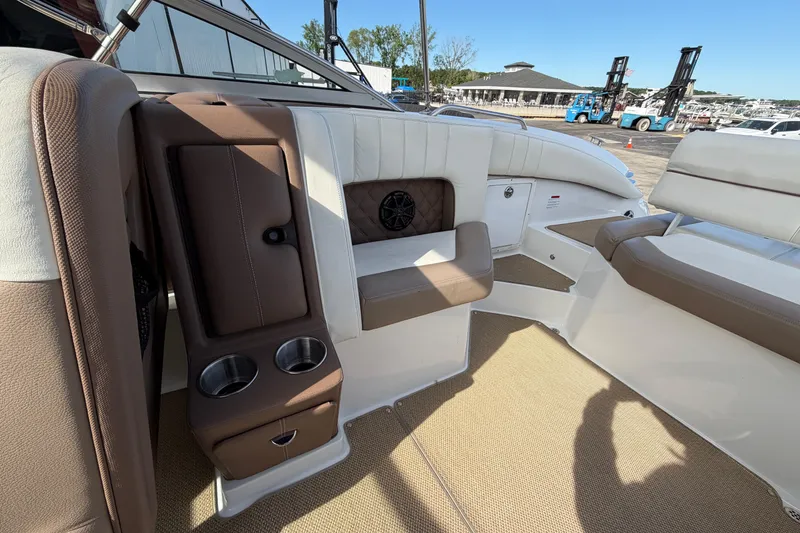Slide: The Image of Interior of a 2013 Cobalt 273 boat with brown and white seating. - 8