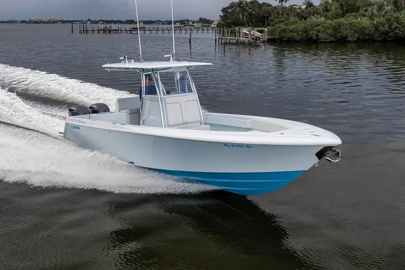 Slide: The Image of 2019 Contender 32 ST boat cruising on a calm waterway. - 20