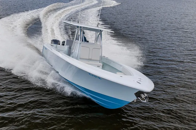 Slide: The Image of 2019 Contender 32 ST boat cruising swiftly on open water. - 34