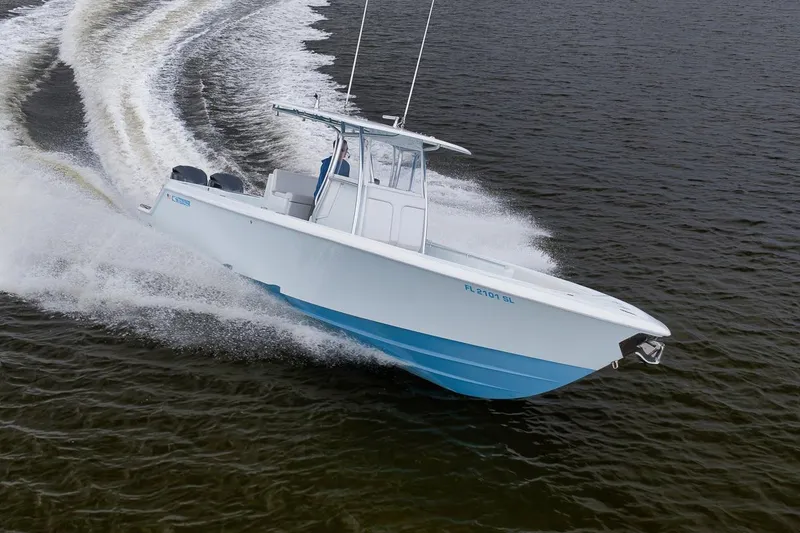 Slide: The Image of 2019 Contender 32 ST boat cruising swiftly on open water. - 39