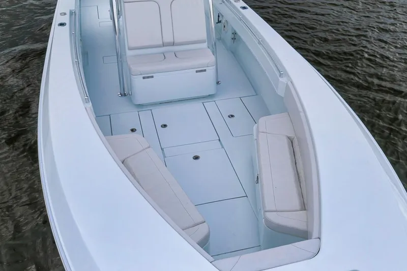 Slide: The Image of 2019 Contender 32 ST boat interior with white seating and spacious deck. - 40