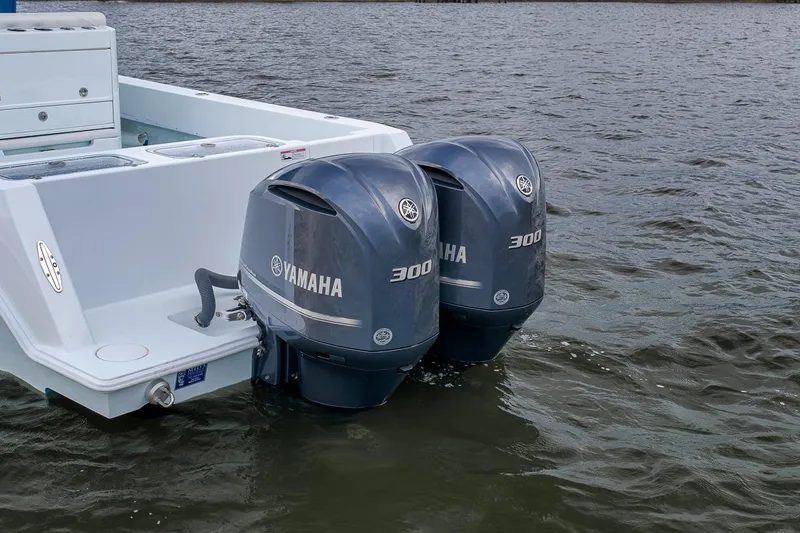 Slide: The Image of 2019 Contender 32 ST boat with twin Yamaha 300 outboard engines on water. - 41