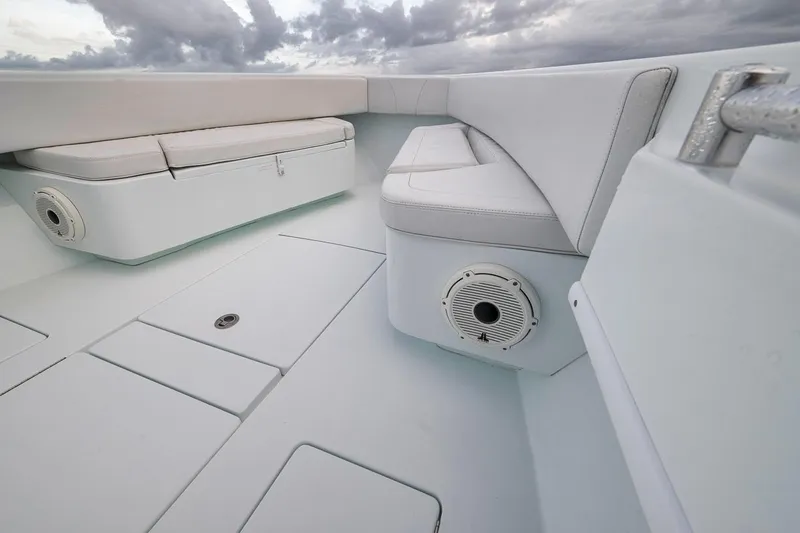 Slide: The Image of 2019 Contender 32 ST boat interior with cushioned seating and speaker system. - 45