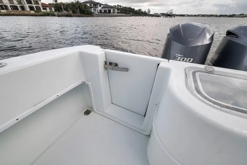 Slide: The Image of 2019 Contender 32 ST boat with Yamaha 300 engines on a calm waterway. - 58