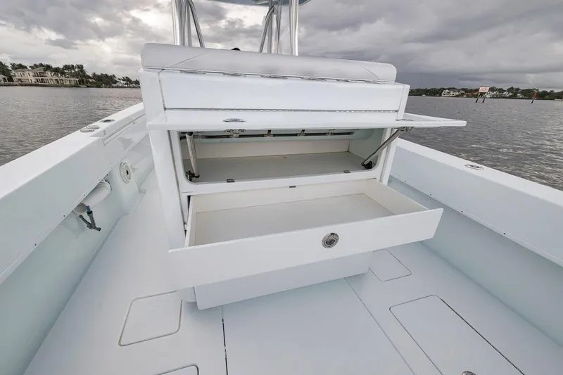 Slide: The Image of 2019 Contender 32 ST boat with open storage compartments on deck. - 61