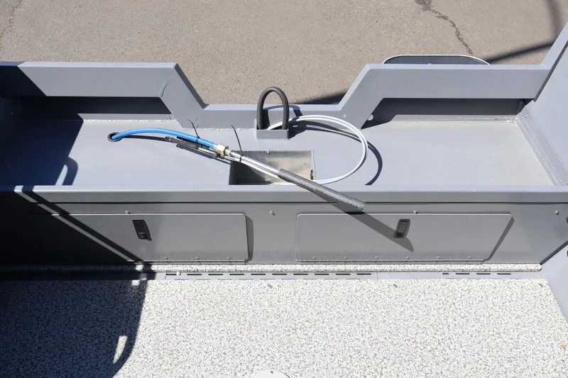 Slide: The Image of 2026 Alumaweld Talon 18 boat interior with hose and storage compartments. - 10