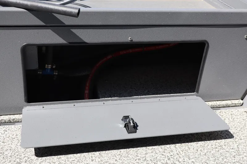 Slide: The Image of Open storage compartment on 2026 Alumaweld Talon 18 boat, showing interior details. - 11