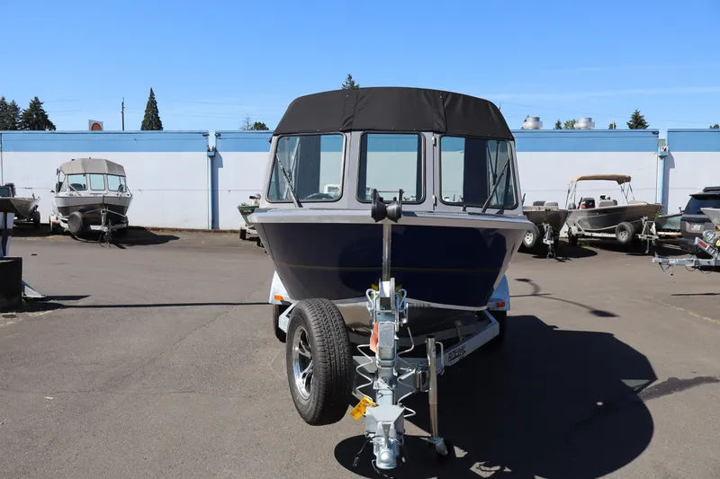 Slide: The Image of 2026 Alumaweld Talon 18 boat on trailer in outdoor lot. - 2