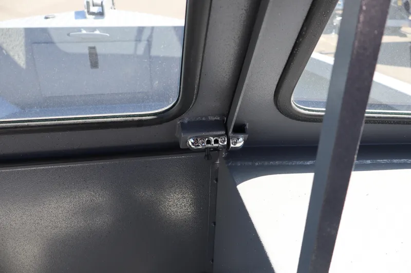 Slide: The Image of Interior view of 2026 Alumaweld Talon 18 boat window frame and latch. - 20