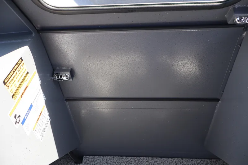 Slide: The Image of Interior view of 2026 Alumaweld Talon 18 boat showing capacity label and metal panel. - 21