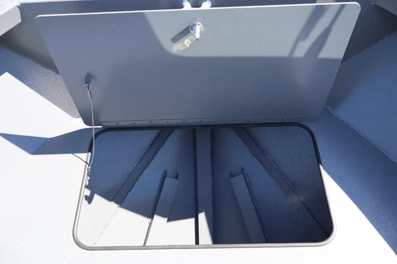 Slide: The Image of Open storage compartment on 2026 Alumaweld Talon 18 boat. - 24