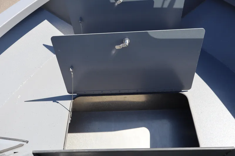 Slide: The Image of Storage compartment of 2026 Alumaweld Talon 18 boat, featuring secure latches and spacious interior. - 25