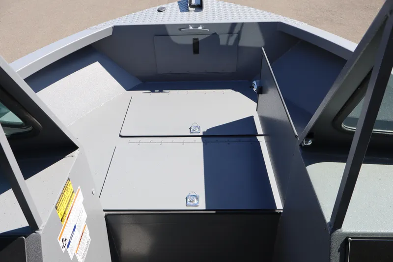Slide: The Image of 2026 Alumaweld Talon 18 boat interior with storage compartments and sleek design. - 26