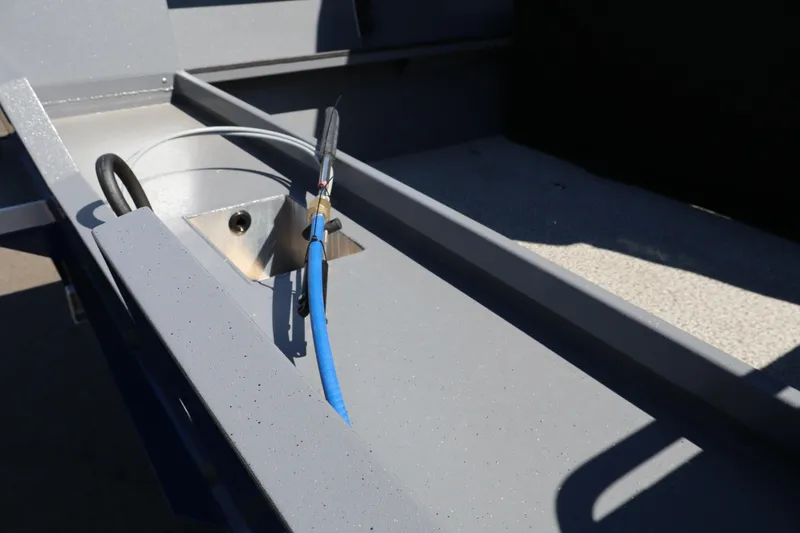 Slide: The Image of 2026 Alumaweld Talon 18 boat interior detail with wiring and metal components. - 8