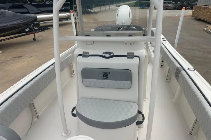Slide: The Image of 2024 Carolina Skiff 21 Ultra Elite boat interior with seating and console. - 12