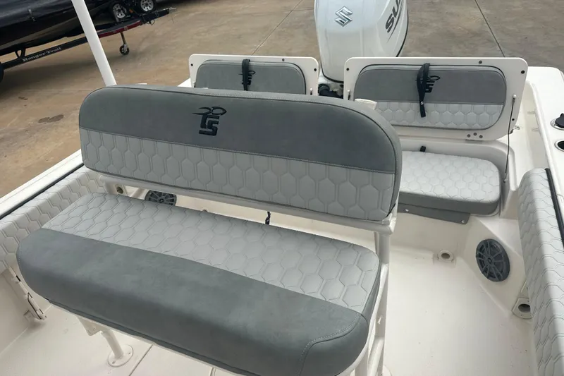 Slide: The Image of 2024 Carolina Skiff 21 Ultra Elite boat interior with gray cushioned seating. - 14