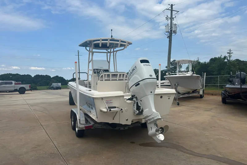 Slide: The Image of 2024 Carolina Skiff 21 Ultra Elite boat with Suzuki outboard motor on trailer. - 4