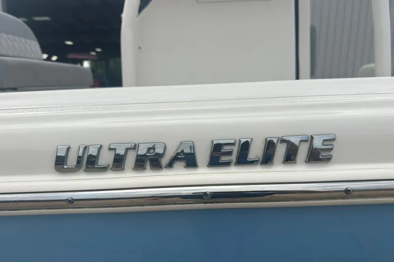 Slide: The Image of 2024 Carolina Skiff 21 Ultra Elite boat logo in chrome lettering. - 7