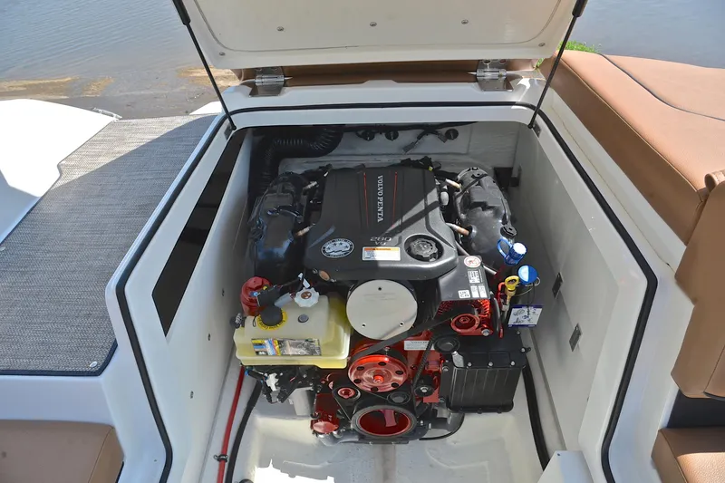 Slide: The Image of 2024 Cobalt CS23 boat engine compartment with Volvo Penta engine, open hatch view. - 27