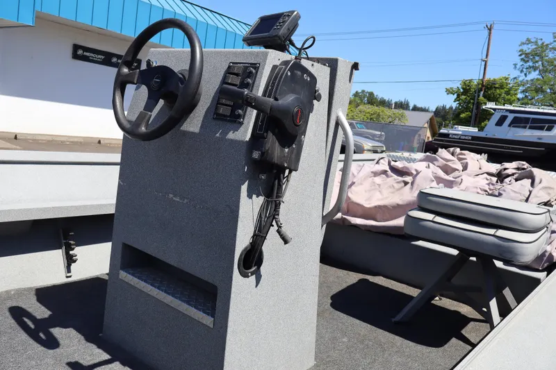 Slide: The Image of 2003 Alumaweld Flatbottom boat interior with steering console and seating. - 12