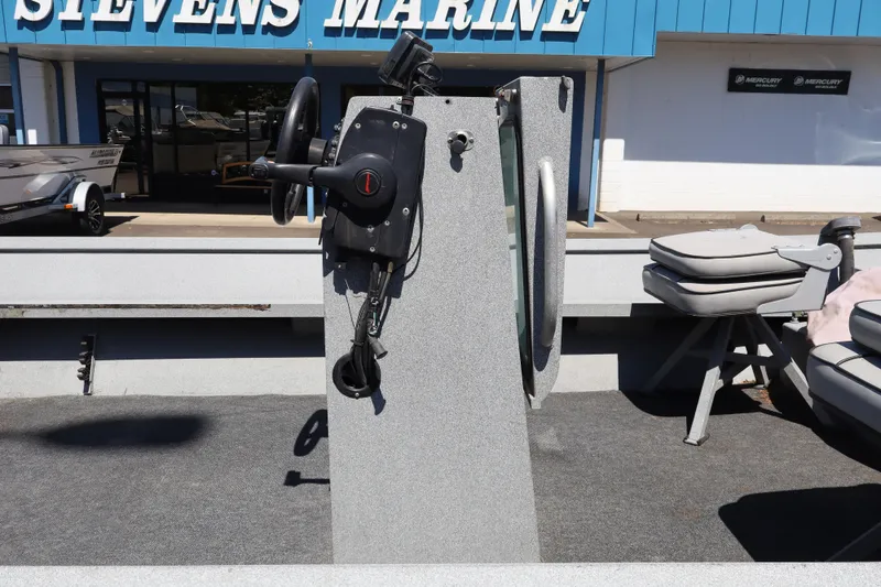 Slide: The Image of 2003 Alumaweld Flatbottom boat interior with steering console at Stevens Marine. - 13