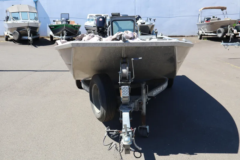 Slide: The Image of 2003 Alumaweld Flatbottom boat on trailer in parking lot. - 2