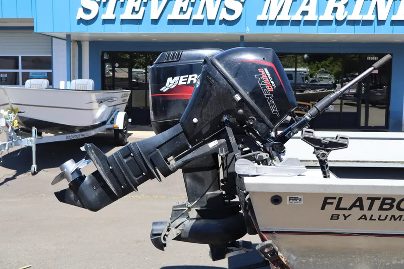 Slide: The Image of 2003 Alumaweld Flatbottom boat with Mercury outboard motor at Stevens Marine. - 5