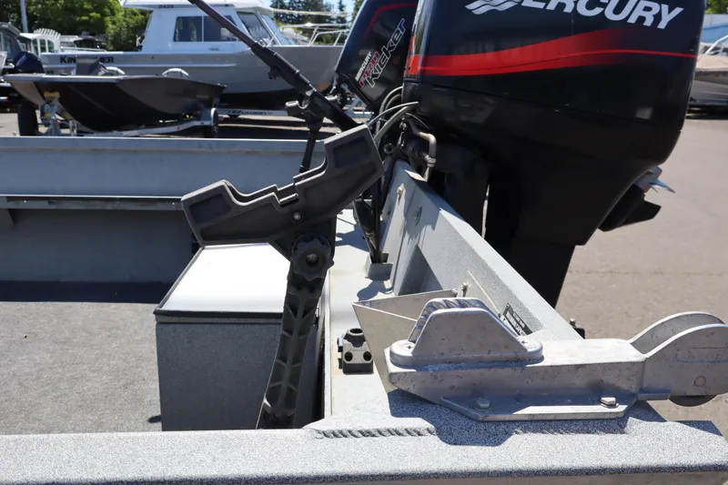 Slide: The Image of 2003 Alumaweld Flatbottom boat with Mercury outboard motor, docked in a marina. - 8