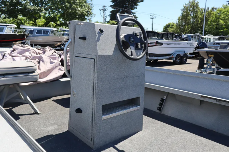 Slide: The Image of 2003 Alumaweld Flatbottom boat interior with steering console and seating. - 9