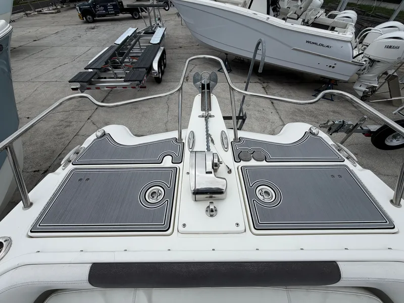 Slide: The Image of 2018 World Cat 255 DC boat parked on a trailer. - 11