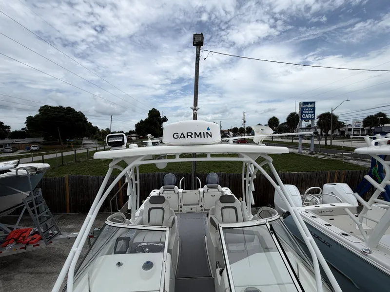 Slide: The Image of 2018 World Cat 255 DC boat with Garmin equipment outdoors. - 12