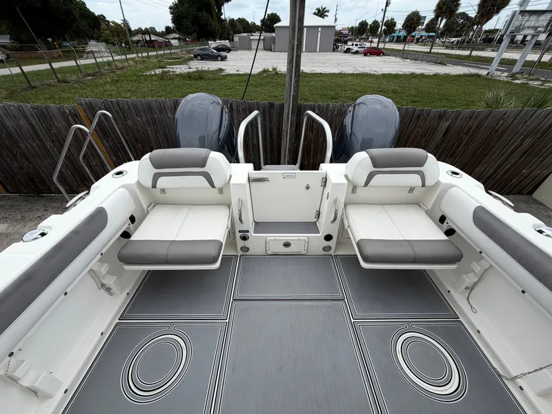 Slide: The Image of Interior of a 2018 World Cat 255 DC boat with gray seating. - 2