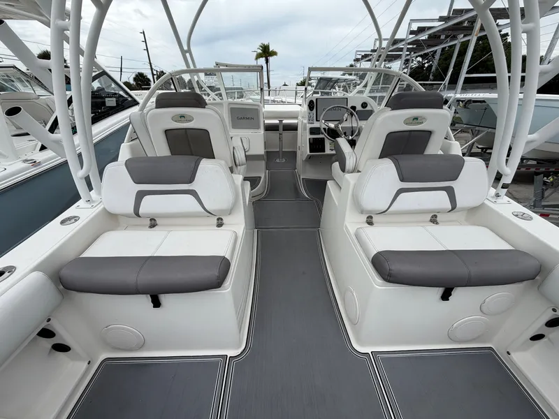 Slide: The Image of Interior of a 2018 World Cat 255 DC boat with gray seating. - 3