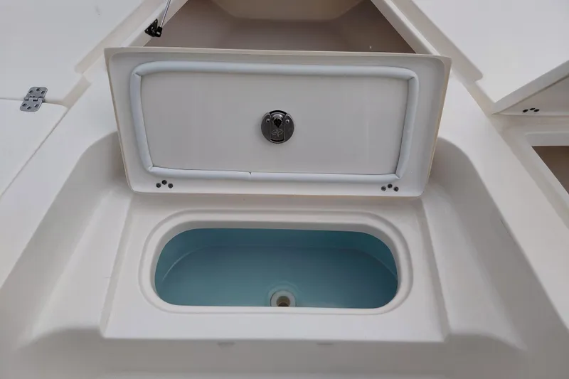 Slide: The Image of Open storage compartment on 2018 Key West 230 Bay Reef boat. - 13