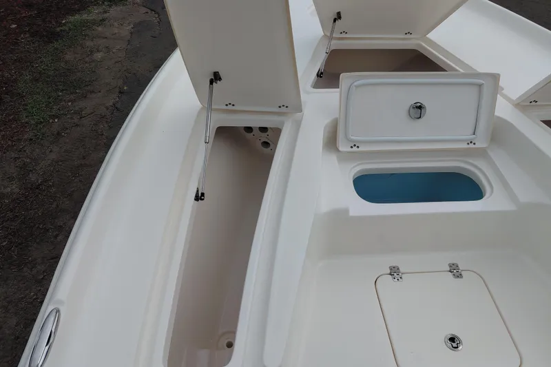 Slide: The Image of 2018 Key West 230 Bay Reef boat storage compartments and livewell, open for viewing. - 14