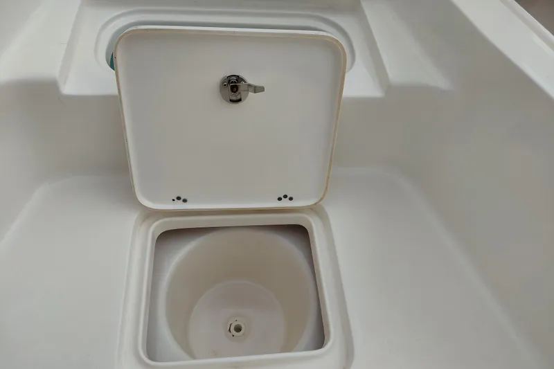 Slide: The Image of Open storage compartment on a 2018 Key West 230 Bay Reef boat. - 15
