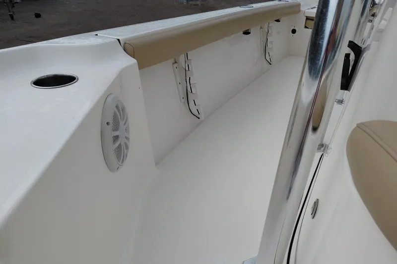 Slide: The Image of 2018 Key West 230 Bay Reef boat interior with speaker and cup holder. - 21