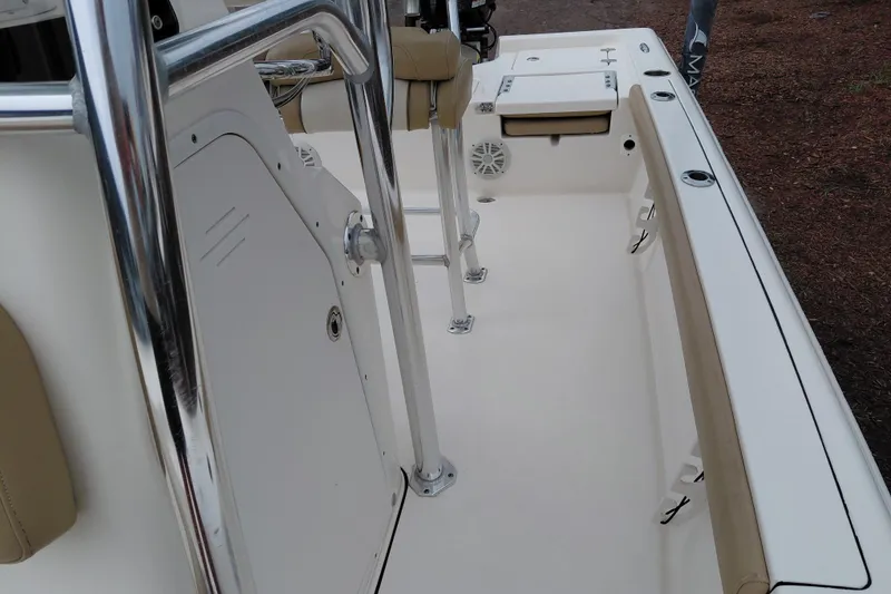 Slide: The Image of 2018 Key West 230 Bay Reef boat interior with seating and stainless steel railings. - 23