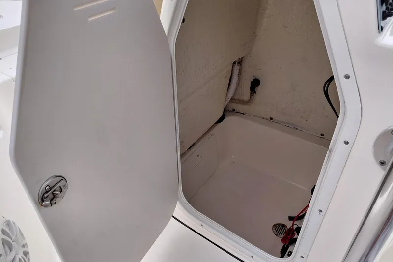 Slide: The Image of Open storage compartment on a 2018 Key West 230 Bay Reef boat. - 24