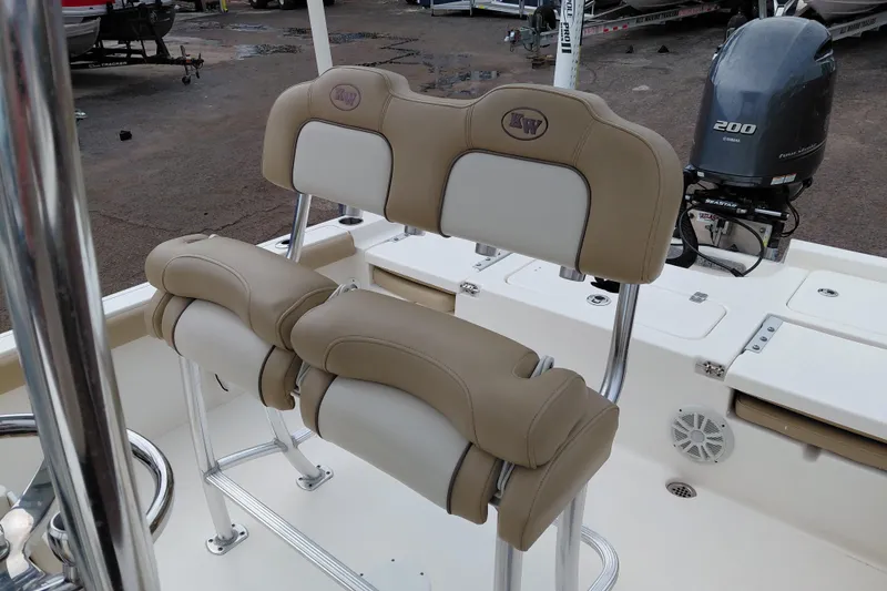 Slide: The Image of 2018 Key West 230 Bay Reef boat with dual beige seats and Yamaha 200 engine. - 26