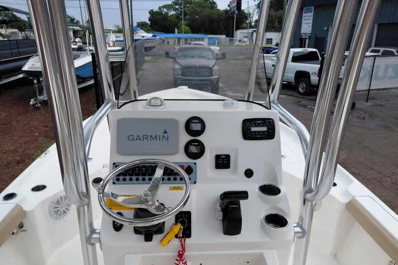 Slide: The Image of 2018 Key West 230 Bay Reef boat console with Garmin navigation system and steering wheel. - 28