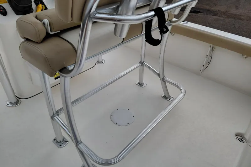 Slide: The Image of 2018 Key West 230 Bay Reef boat interior with seating and metal frame. - 29