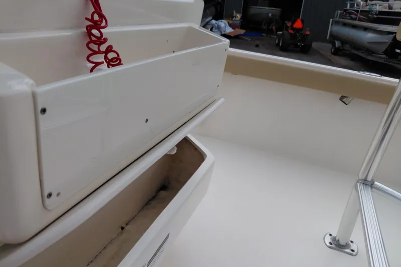 Slide: The Image of Interior view of a 2018 Key West 230 Bay Reef boat, showcasing storage compartments. - 30