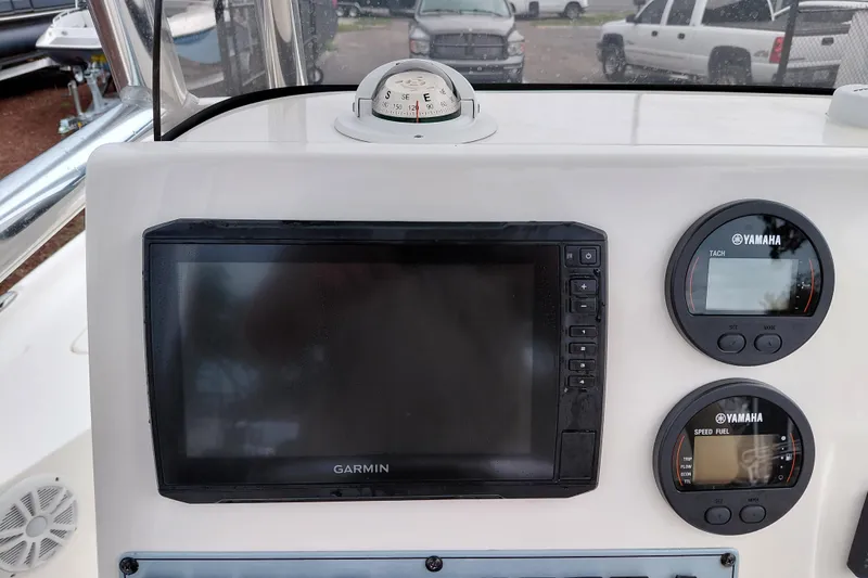 Slide: The Image of Control panel of a 2018 Key West 230 Bay Reef boat with Garmin and Yamaha displays. - 33