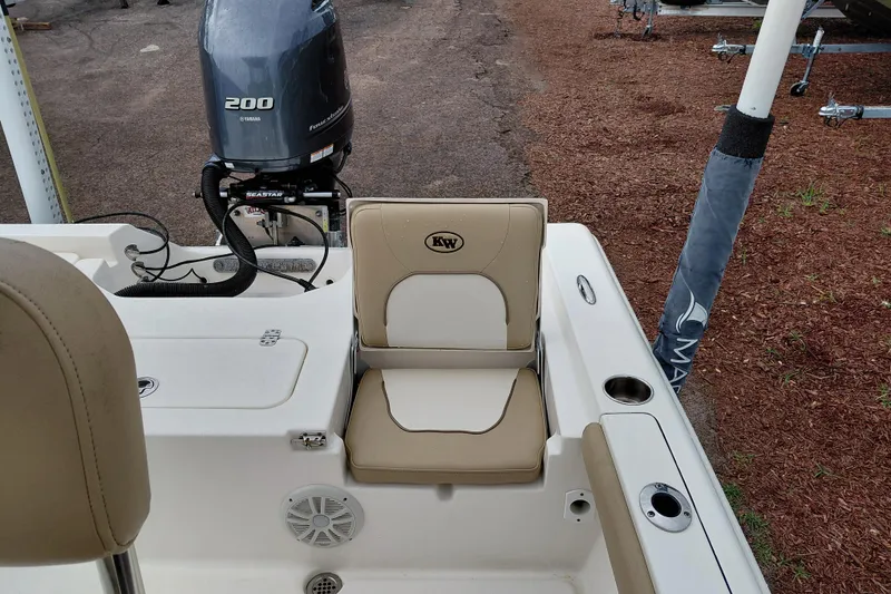 Slide: The Image of 2018 Key West 230 Bay Reef boat with Yamaha 200 engine, featuring beige seating. - 37