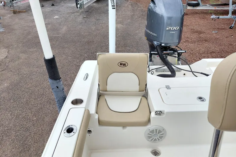Slide: The Image of 2018 Key West 230 Bay Reef boat with Yamaha 200 engine, featuring beige seating. - 38