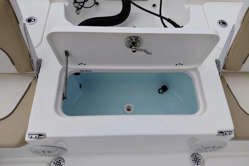 Slide: The Image of Livewell compartment on a 2018 Key West 230 Bay Reef boat, open with water inside. - 39