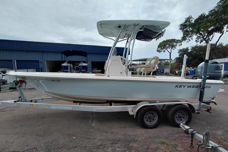 Slide: The Image of 2018 Key West 230 Bay Reef boat on trailer, parked outdoors. - 4